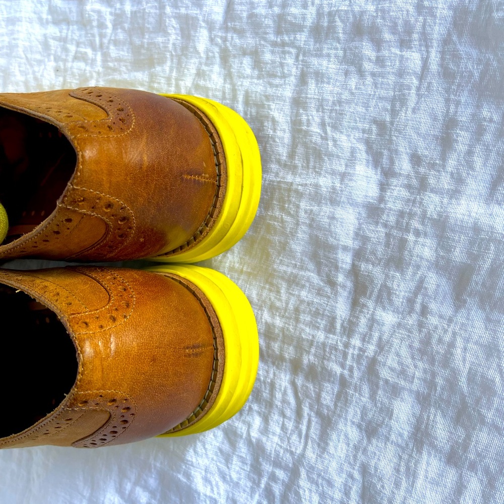 Women’s Cole Haan wingtip shoes.